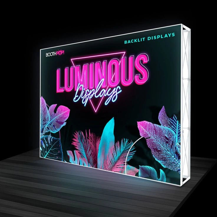 Luminous Displays backlit display with neon text and leaf designs on a dark background