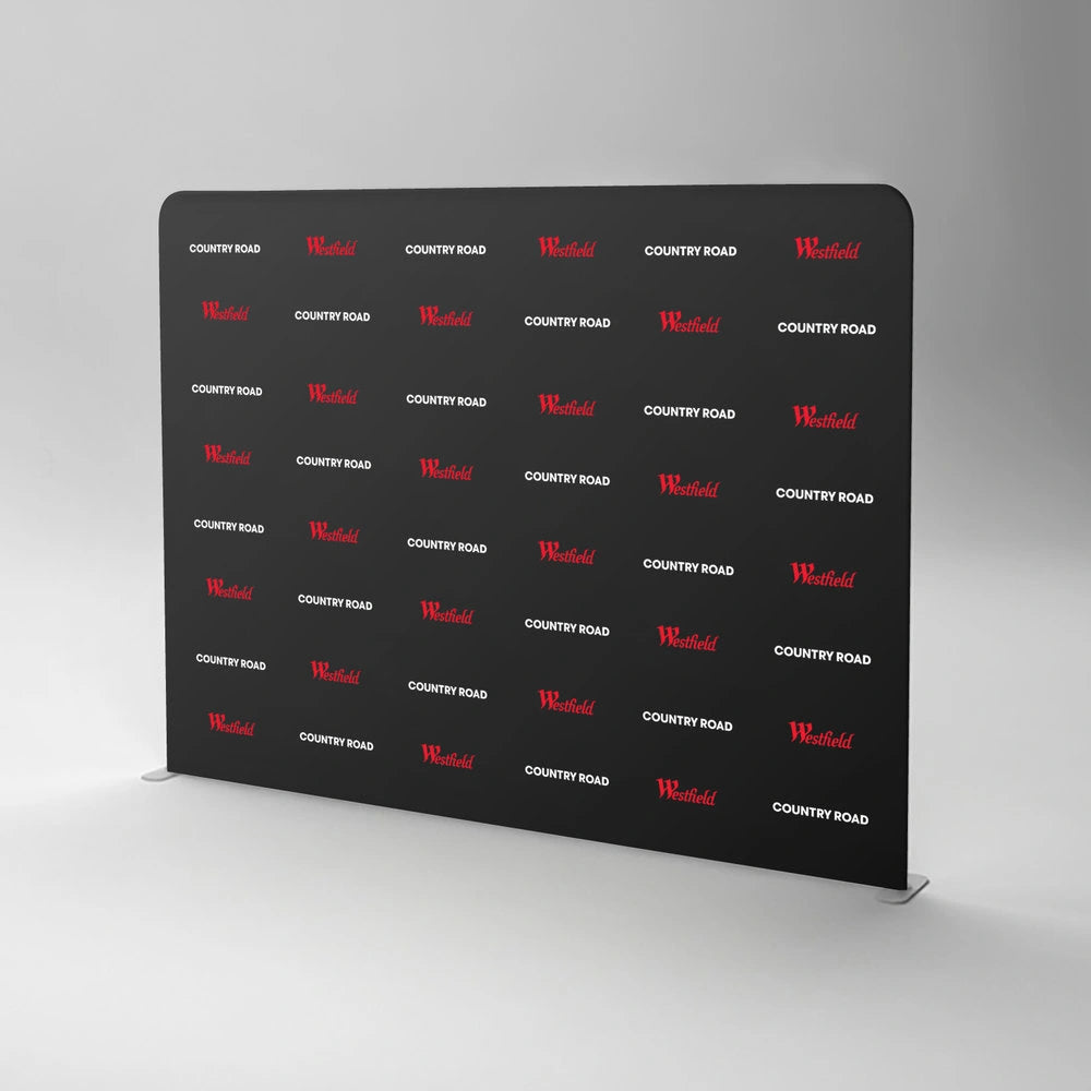Black backdrop with red and white text on a gray background