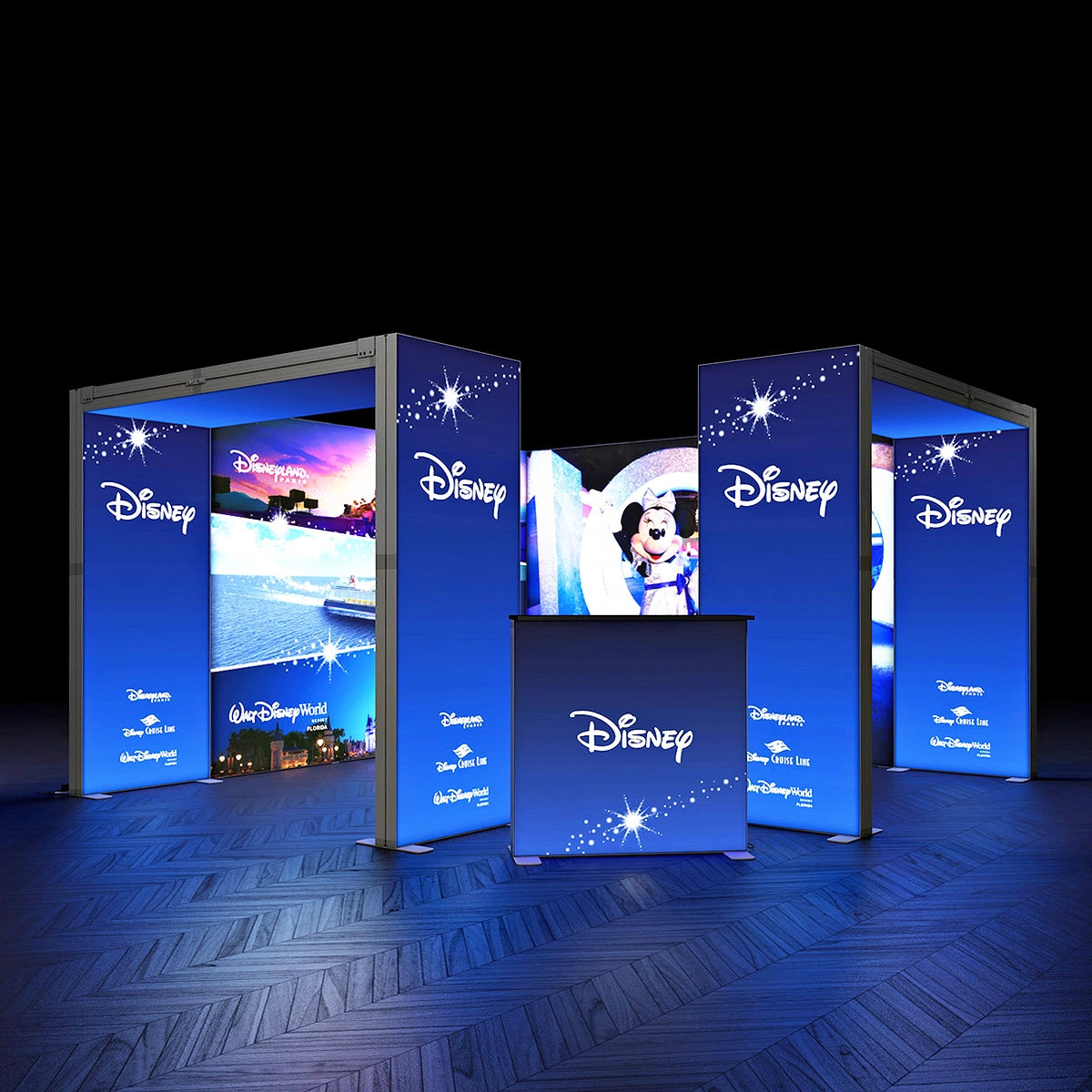 Set of Disney-themed display stands with illuminated screens on a dark floor.