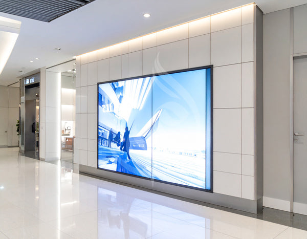 Large digital display on a wall in a modern indoor setting