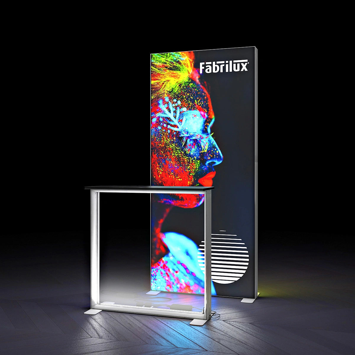 Digital display stand with colorful artwork and 'Fabrilux' branding on a dark background