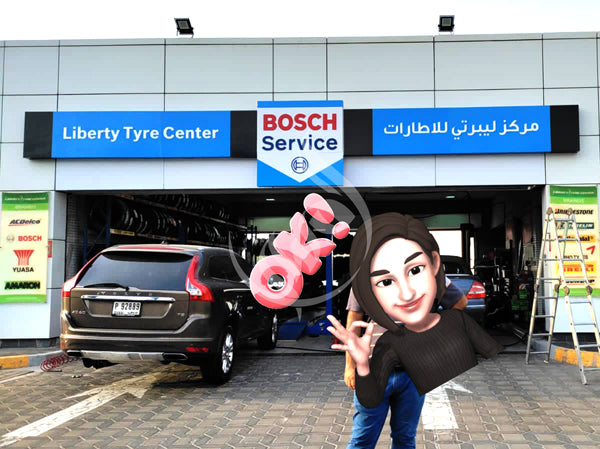 Bosch Service center with a car and person in front