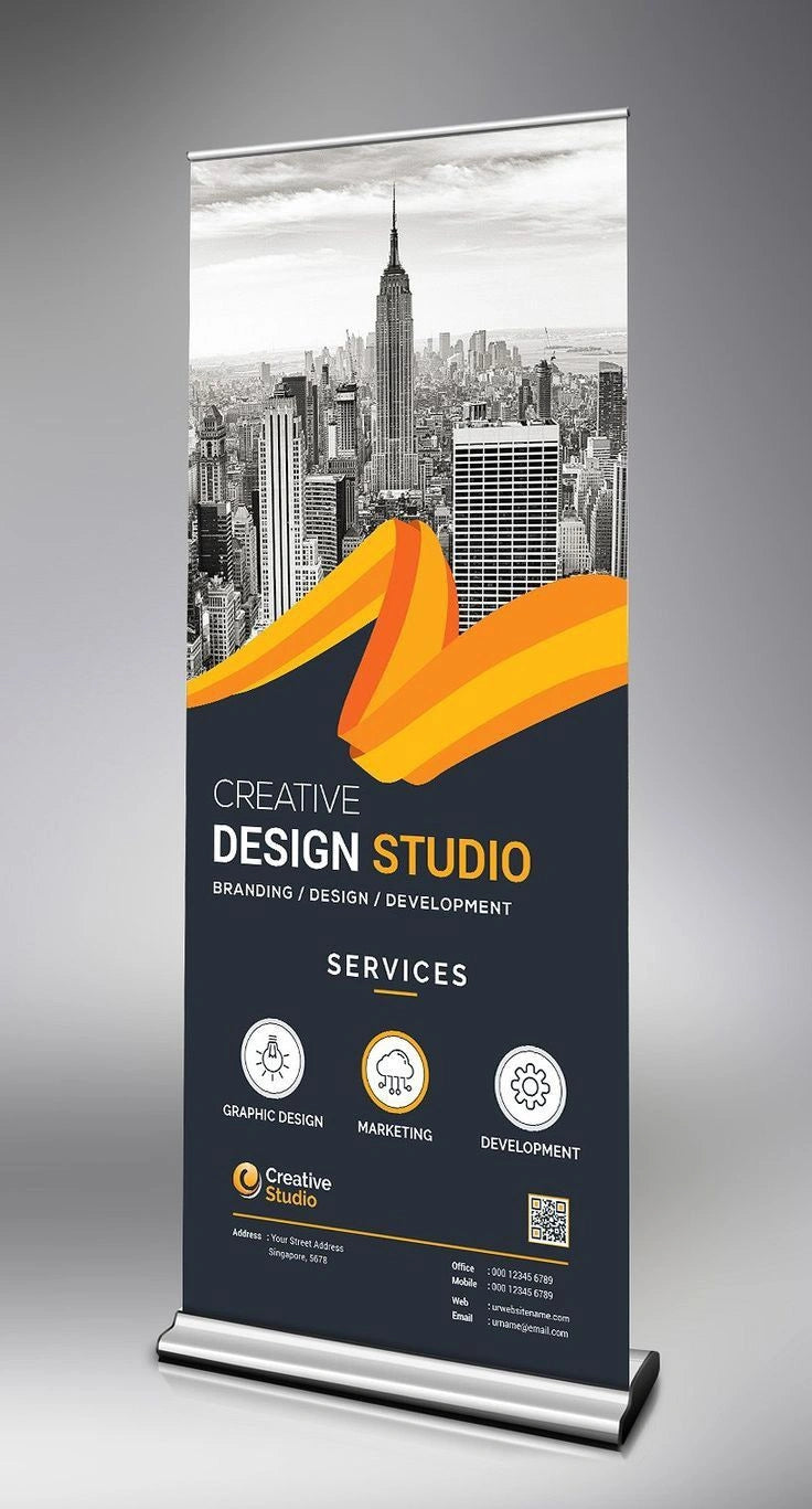 Roll-up banner for a creative design studio with a cityscape background