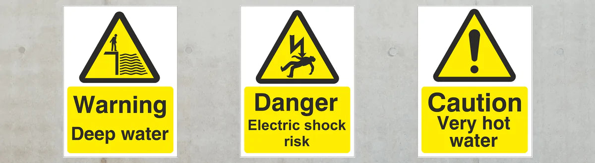 Three warning signs indicating deep water, electric shock risk, and very hot water on a gray background.